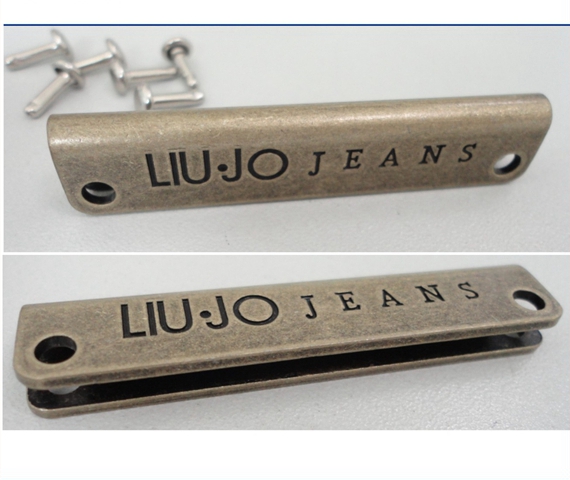 engraved metal logo